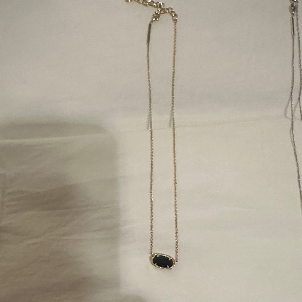 Elegant Gold Necklace with Black Pendant